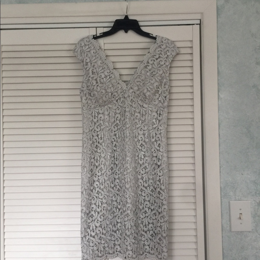 Lace cocktail length dress silver